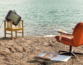 vintage decor on the lake shore, armchair and television